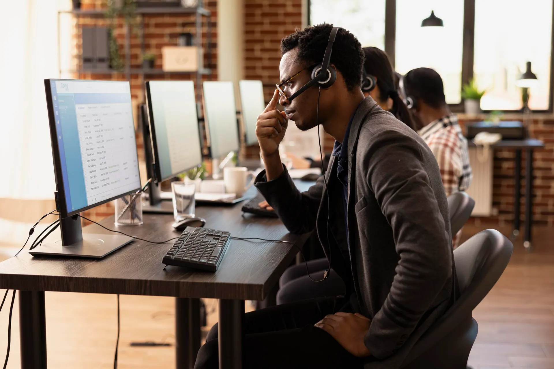 NASD PLC support team member on a headset