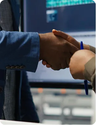 Business handshake symbolising debt agreements