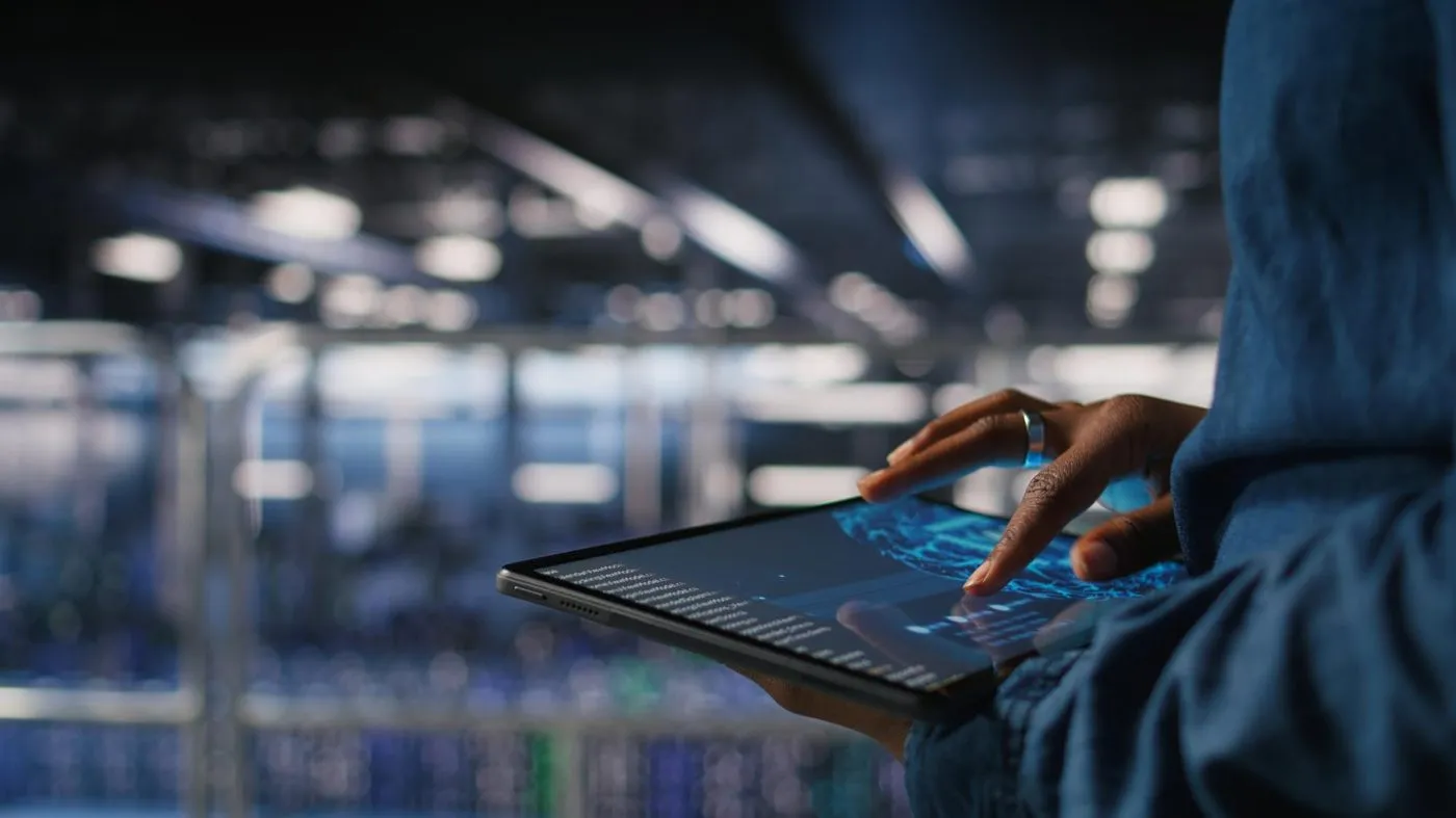 Analyst reviewing market data on a tablet