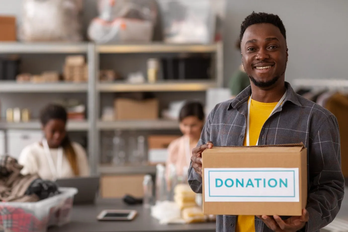 A donor packing a donation box